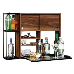 Limited space won't stop your home from being the life of the party. Impress your guests with the sophisticated style and innovative design of this wall bar from the Harvey Park collection. It features a flip-down bar top that creates a convenient mixing station which provides you with plenty of room to create your favorite cocktails. Behind the flip-down bar top is a hidden storage space for you to stow away your favorite beverages. It also includes two adjustable shelves for flexible storage options of items of all different shapes and sizes. Behind the sliding doors is an additional hidden storage area that is ideal for holding glasses