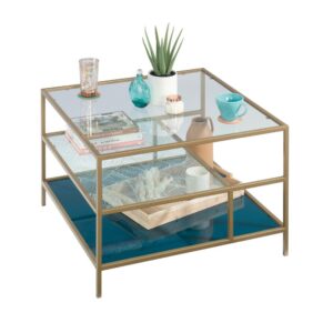 Create a centerpiece in your living room that will wow all your guests with the coastal-inspired style and unique design of this square glass coffee table from the Coral Cape® collection. This one-of-a-kind glass and metal coffee table features three safety-tempered glass shelves. The middle shelf features a banana leaf abstract pattern and the lower shelf features teal tinted silk-screened glass that is sure to stand out. Its spacious top surface provides you with room for items like stacks of magazines