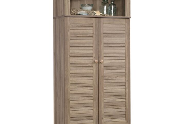 Stylish storage is something that every home needs. Create versatile storage options while adding a beautiful touch of cottage-inspired style with this two door storage cabinet from the Harbor View® collection. Behind its louver detailed doors is a hidden storage area that will contain all your clutter and chaos. It includes one fixed shelf along with one adjustable shelf for flexible storage options for items of all shapes and sizes. Stow away and organize things like pantry items