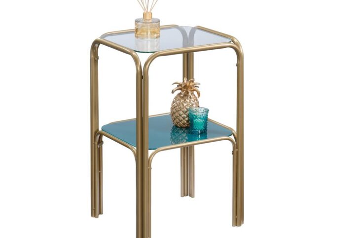 Is your home beginning to look a little boring and bland? We can fix that! Give your home the pop of style it needs when you add the coastal-inspired style and design of this glass top side table from the Coral Cape® collection. This stunning gold side table features two safety-tempered glass shelves that add an eye-catching design element. The lower shelf is detailed with a teal tinted silk-screened glass surface that will really stand out in your home. The top shelf provides you with the ideal amount of space for items like an accent lamp