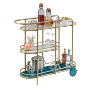 Who doesn't love the perfect bar cart? We sure do! Create a one-of-a-kind aesthetic in your home with the unique design and charming good looks of this modern bar cart from the Coral Cape® collection. This metal bar cart features three safety-tempered glass shelves. The spacious top shelf provides you with the room you need for various items like glass bottles