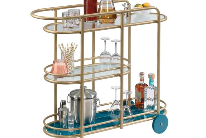 Who doesn't love the perfect bar cart? We sure do! Create a one-of-a-kind aesthetic in your home with the unique design and charming good looks of this modern bar cart from the Coral Cape® collection. This metal bar cart features three safety-tempered glass shelves. The spacious top shelf provides you with the room you need for various items like glass bottles