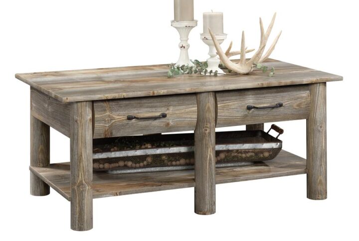 Bring your love of the outdoors right to the center of your living room with this coffee table from the Boone Mountain collection. This rustic coffee table offers a spacious top surface that provides you with room for items like magazines