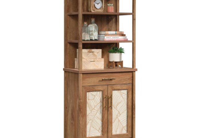 Style and storage all in one. Add a touch of tropical inspired style and design to your home with this bookcase with doors from the Coral Cape® collection. This tall bookcase features open shelving that includes three spacious shelves that are ideal for storing and displaying a variety of different items like stacks of books