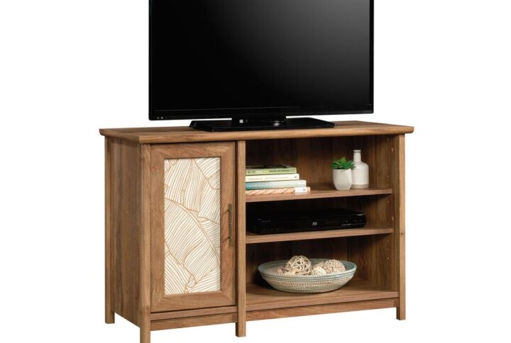 The center of attention in your living room deserves a stylish counterpart. Add a touch of tropical-inspired design and beauty to any room in your home with this TV stand from the Coral Cape® collection. This TV credenza accommodates up to a 42" TV