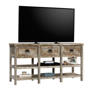 A rustic TV credenza makes the perfect cozy living room. With this entertainment credenza from the Granite Trace collection