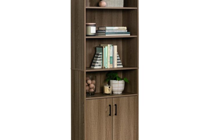 Are you beginning to run out of storage space in your home? No worries. We've got you covered! Create the additional storage options you need all while adding the style that you love with this bookcase with doors from the Beginnings® collection. This storage cabinet offers spacious open shelving that includes four shelves that are perfect for storing and displaying a variety of different items like books