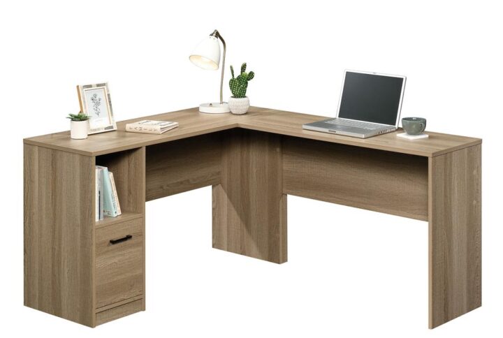 It's time to take care of business! Find the motivation you need to tackle all your projects when you add the beautiful style and increased functionality of this L-shaped desk from the Beginnings® collection. This home office desk offers a spacious top surface that provides you with all the room you need for desk essentials like your laptop