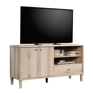 Your big TV deserves a stylish companion. Add a touch of beautiful style and functional design to your living room with this TV credenza from the Willow Place® collection. This TV stand with doors accommodates up to a 60" TV