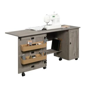 Sewers rejoice! Create a convenient workspace for all your sewing and crafting needs while adding beautiful style to any room in your home with this sewing/craft cart from the Sauder Select collection. This drop leaf craft table offers a spacious top surface that provides you with the room you need for all your supplies like your sewing machine