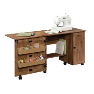 It's a sewer's dream come true! Create the space you need to work on all your big sewing and crafting projects with this sewing/craft cart from the Sauder Select collection. This sewing craft table offers a spacious top surface that provides you with the room you need for all your supplies like your sewing machine