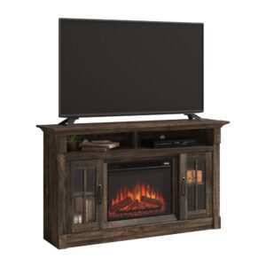 making it the perfect spot to binge watch your favorite movies or catch the big game. Make things extra cozy with the electric firebox that heats up to 400 square feet. It includes a remote control and built-in overheat protection. The divided storage is ideal for holding audio/video equipment or even a little home décor. Behind each framed