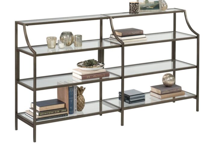 Is your home décor looking a bit boring and bland? Give your home a sophisticated new look when you add the luxurious style and modern design of this metal and glass console table from the International Lux® collection. This bronze console table features open storage that includes three large shelves and one narrow shelf to conveniently store and display items like decorative plants