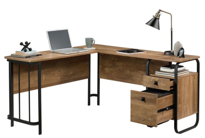 Find the motivation to tackle all your big projects when you add the rustic-inspired style and functional design of the L-shaped desk from the Station House® collection. This home office desk offers a spacious top surface with ample room for your office essentials like notepads