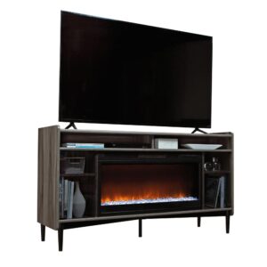 Bring your friends and family together for memories that will last a lifetime with this entertainment/fireplace credenza from the Harvey Park® collection. This TV stand with electric fireplace accommodates up to a 60" TV weighing 70 lbs or less—A TV large enough for everyone to come over and watch the big game. This entertainment fireplace includes an adjustable shelf behind each tinted