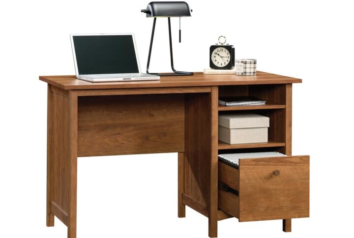 A simple desk that never goes out of style. This single pedestal desk from the Union Plain® collection will bring the basics back to the home office. This home office desk features a file drawer with full extension slides that holds all of your important letter-size hanging files. Or you could use it as a deep drawer for general storage. A convenient open storage area with an adjustable shelf allows you to customize the storage space of this computer desk with filing drawer to your liking. This open storage space is ideal for books