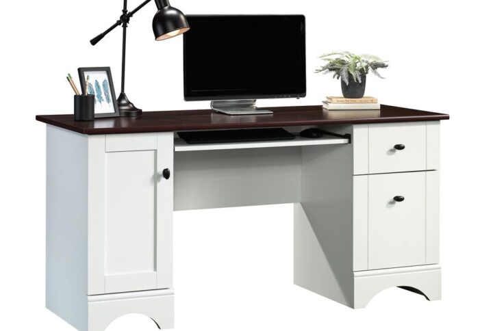 There's no fooling around here—this computer desk from the Sauder Select collection means business. This home office desk is equipped with a slide-out keyboard/mouse shelf with metal runners and safety stops that keep your work from home ergonomics tip top while preserving your top surface space. The top surface is big enough for all your home office essentials: a computer