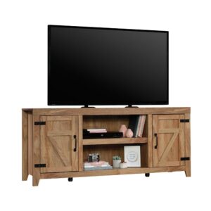 Is your home décor beginning to look a little boring and bland? Give it an upgrade with the rustic charm and unique design of this credenza from the Sauder Select collection. This farmhouse TV stand accommodates up to a 70" TV weighing 95 lbs. or less