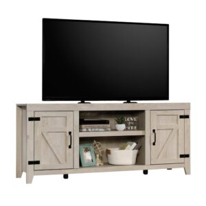 A farmhouse look with modern flare -- this TV credenza from the Sauder Select collection reminds you of simpler times with rustic charm and unique design. This farmhouse TV stand accommodates up to a 70" TV weighing up to 95 lbs.