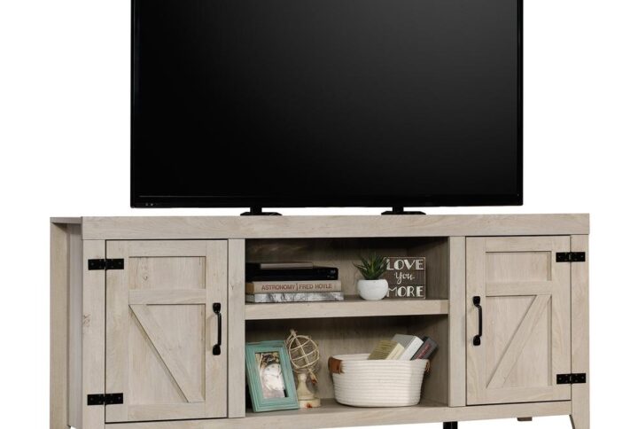 A farmhouse look with modern flare -- this TV credenza from the Sauder Select collection reminds you of simpler times with rustic charm and unique design. This farmhouse TV stand accommodates up to a 70" TV weighing up to 95 lbs.