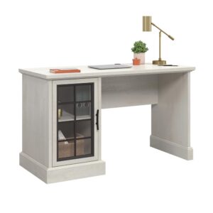 notepads and a lamp. Behind the framed door with safety-tempered glass is a storage area that includes an adjustable shelf that creates flexible storage for a variety of items. The top includes a grommet hole