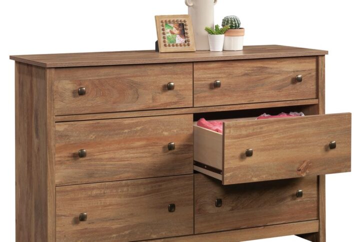 Have enough storage until the cows come home. This dresser from the River Ranch® collection offers 6-drawer storage for any style of home décor. This bedroom dresser features six drawers on metal runners and safety stops. The lower four drawers of this 6-drawer dresser are extra deep