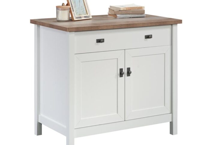 In need of a little extra storage space to complete your home office or workspace? This library cabinet can accommodate that assignment! Build a setting with the storage space you need while incorporating the style that you desire with this library base cabinet from the Cottage Road collection. Behind its two framed doors is a closed storage area that includes a large adjustable shelf that can move to different heights