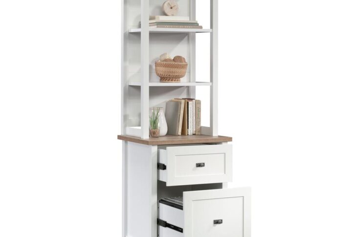 This furniture piece is anything but a predictable and boring tower storage cabinet. A convenient and trendy addition to the home or home office