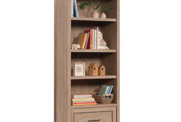 Add a touch of timeless beauty and charming style to your home with this bookcase with drawer from the Rollingwood™ collection. This bookcase with storage features three adjustable