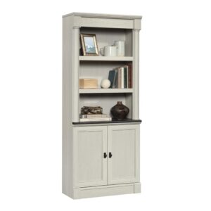 No home office is complete without convenient storage and organization. Tidy up your workspace without having to sacrifice on style with this library bookcase with doors from the Palladia® collection. This library bookcase with doors features spacious shelving that provide you with the space to store and display various items such as your collection of books