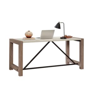 Invite the soothing simplicity of modern farmhouse into your office space with this commercial office desk. The base of this residential office furniture is finished in the natural