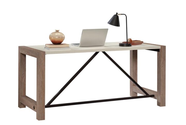 Invite the soothing simplicity of modern farmhouse into your office space with this commercial office desk. The base of this residential office furniture is finished in the natural