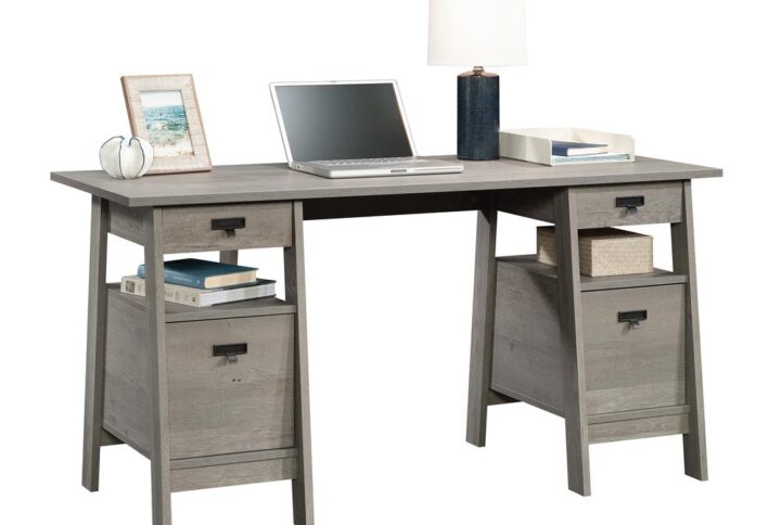 Upgrade your project workspace with this executive desk with drawers from the Trestle® collection. This home office desk offers a spacious top surface that provides you with all the room you need for your must-have desk essentials like your laptop