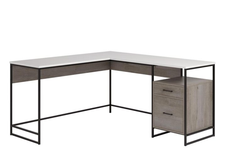 It's time to take care of business! Find the motivation you need to tackle all your big projects with the minimalist style and design of this L-shaped desk from the Tremont Row™ collection. This L-shaped computer desk offers a spacious top surface that provides you with the room you need for all your must-have desk essentials like your laptop or computer