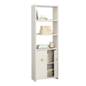 Display it or conceal it; stack it or store it; this bookcase with doors from the Grand Coast™ collection is a beachfront vacation from your typical storage options. Finished in gentle and glowing Dove Linen™