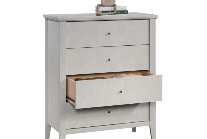 Don't let the lack of storage space in the bedroom ruin your mood. Create the convenient storage options that your bedroom craves without having to sacrifice on style with this 4-drawer chest from the Larkin Ledge™ collection. This country bedroom chest of drawers features four spacious drawers that open and close on smooth metal runners. These large drawers are perfect for stowing away a variety of apparel like stacks of denim