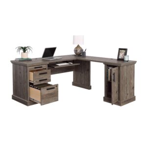 A home office desk is a vital component to any home. The L-shaped desk from the Aspen Post collection is the do-all solution for setting up an office. This L- desk features a slide out shelf with metal runners for your keyboard and mouse which frees up the top surface for other office essentials. Conveniently