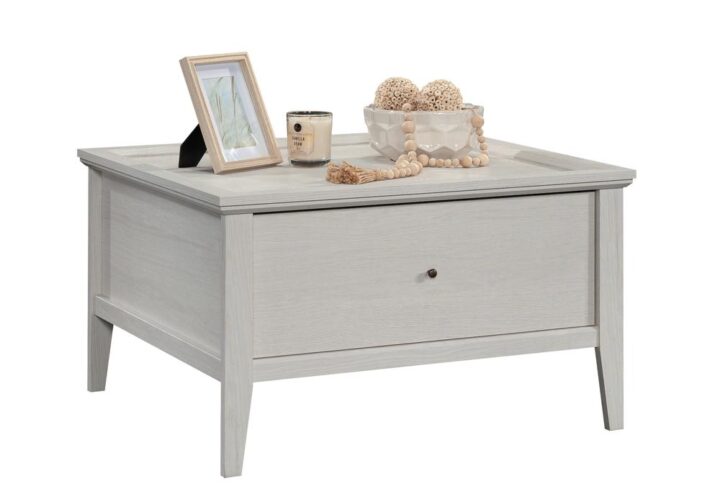 A coffee table can be a key furniture item in any living room. The refined classic styling of this coffee table with drawer from the Larkin Ledge collection will bring not only a fresh look