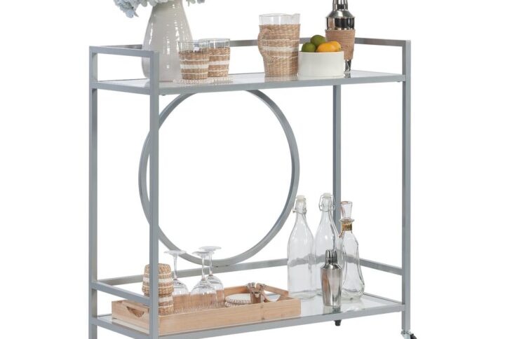 Appetizers or drinks anyone? Take hosting to the next level or to the next room with this rolling bar cart from the International Lux collection. This classic bar cart with wheels features two