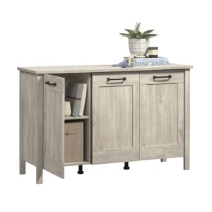 Boost your style while elevating your organization level with the Sauder Select 3-door storage cabinet. This sophisticated storage cabinet with doors seamlessly combines an elegant and classic aesthetic with ample storage solutions. Behind its three trendy