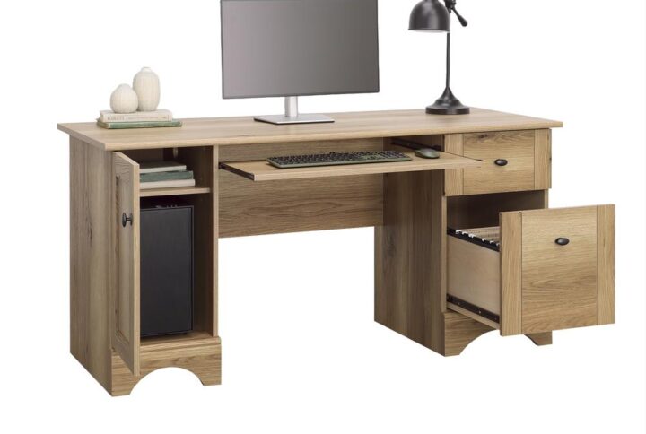 Work in style at home or in the office with the Sauder Select collection computer desk with drawers in Timber Oak finish. This home office desk features a slide-out keyboard/mouse shelf with metal runners and safety stops to keep the surface workspace free