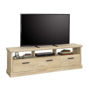 cottage style into your home with this entertainment credenza in Prime Oak finish from the Aspen Post collection. This TV stand with drawers can hold up to a 70-inch television for your entertainment needs and boasts a durable