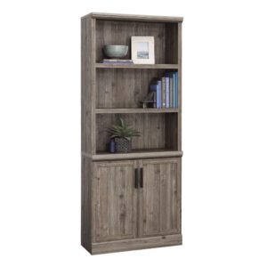 Finished in a distressed and sophisticated Pebble Pine and accented with stylish wrought iron hardware