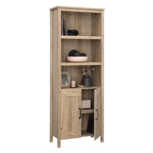 The 5-shelf bookcase from the Sauder Select collection offers the form and function of a library with a rustic flair. Finished in the natural woodgrain hues of Khaki Pine