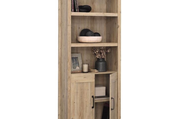 The 5-shelf bookcase from the Sauder Select collection offers the form and function of a library with a rustic flair. Finished in the natural woodgrain hues of Khaki Pine