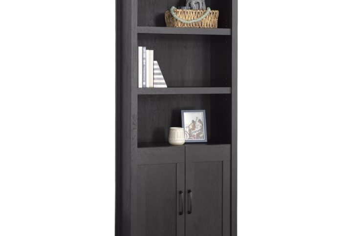 The 5-shelf bookcase from the Sauder Select collection is a modern farmhouse marvel that combines style and functionality in one elegant piece. This transitional bookcase offers three adjustable shelves (one behind the doors)