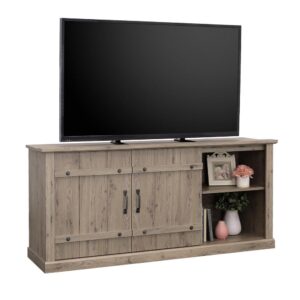 this farmhouse TV stand from the Sauder Select collection harkens back to a time of simple country charm. This TV stand features two sliding doors inspired by farm country architecture. The barn doors slide open for additional hidden storage. This TV credenza accommodates up to a 70" TV weighing up to 95 lbs.