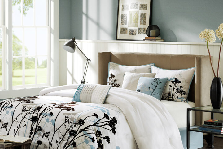 Lighten up your bedroom with the Madison Park Matilda Collection. This beautiful set is made from a printed polyester microfiber with dark brown flocking on the design and a brushed polyester reverse. The addition of flocking to this set gives a three-dimensional look to the top of bed for added value. The pale blue floral design works well against the stark dark brown for the perfect balance. Three decorative pillows provide piecing and embroidery details pulling this entire look together.