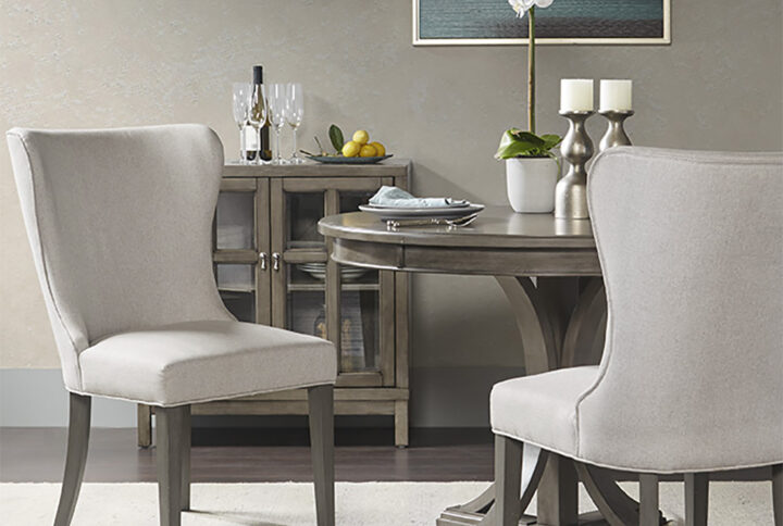 Style and sophistication await you with the Madison Park Signature Helena Dining Chair. The upholstered seat and back are filled with high-density foam providing exceptional comfort and support. A grey wood finish completes the elegant style of this dining room chair. Leg assembly is required.