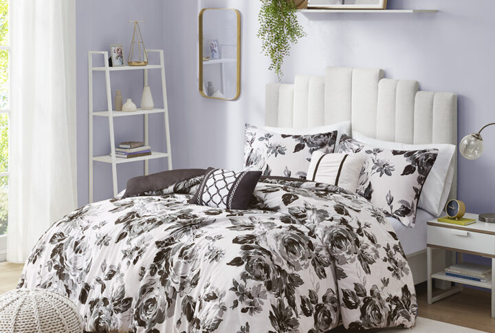 Transform your bedroom with the beautiful contrast of the Intelligent Design Dorsey Floral Print Duvet Cover Set. The ultra-soft microfiber duvet cover and sham(s) flaunt a floral print in black and white for an elegant appeal. A solid black reverse on the duvet cover complements the top of the bed with a bold touch. Two decorative pillows with hypoallergenic filling are also included to complete the bedding set. Machine washable for easy care